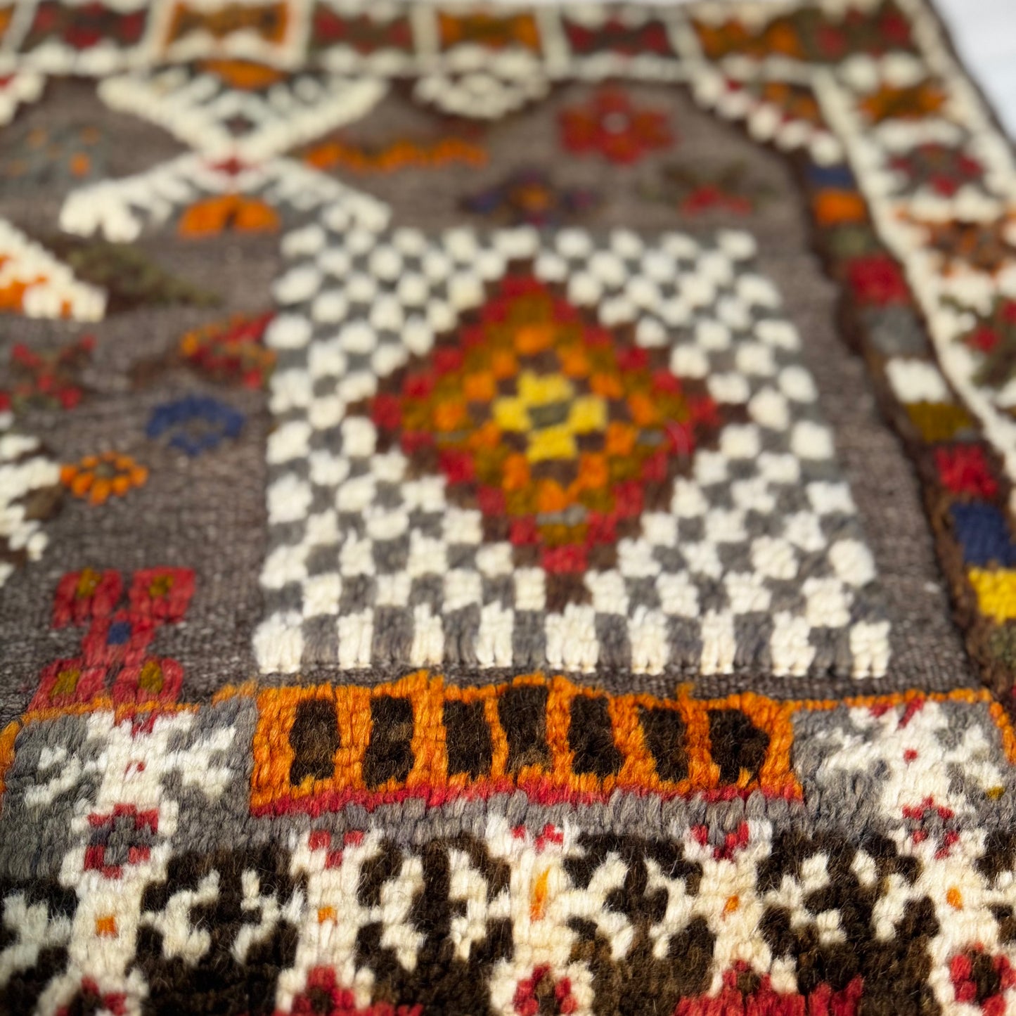 Close-up of a patterned rug with geometric design
