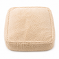 Beige textured square pillow on a white background