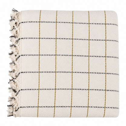 White blanket with black and yellow striped pattern and tassels on a white background