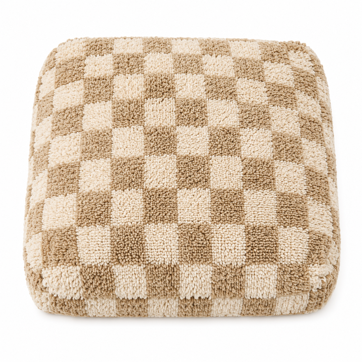Checkered cushion with brown and beige squares on a white background