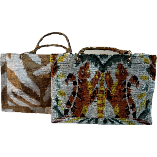 Two woven bags with animal pattern designs on a white background