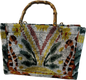 Handbag with a patterned design and bamboo handle on a white background
