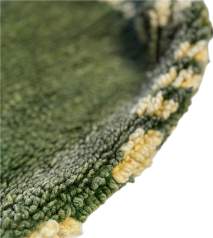 Close-up of a green textured surface with yellowish-brown patterns