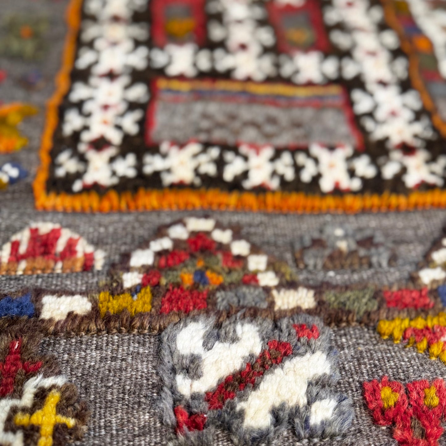 Close-up of a colorful woven textile with intricate patterns