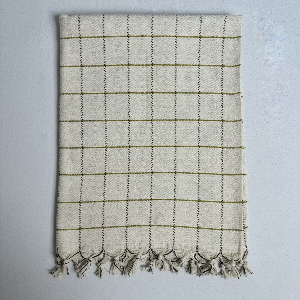 Folded fabric with a checkered pattern on a gray background