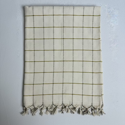 Folded fabric with a checkered pattern on a gray background