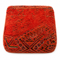 Red textured clutch bag with geometric pattern on a white background