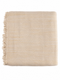 Yellow woven blanket with fringes on a white background